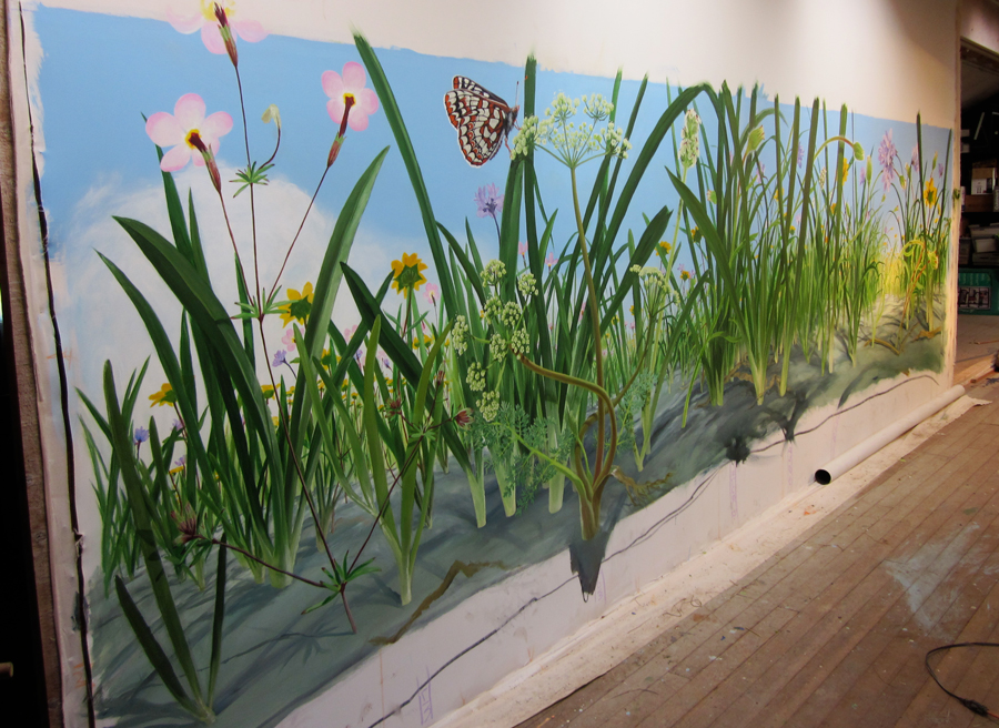 An overview of the serpentine flower mural prior to installation